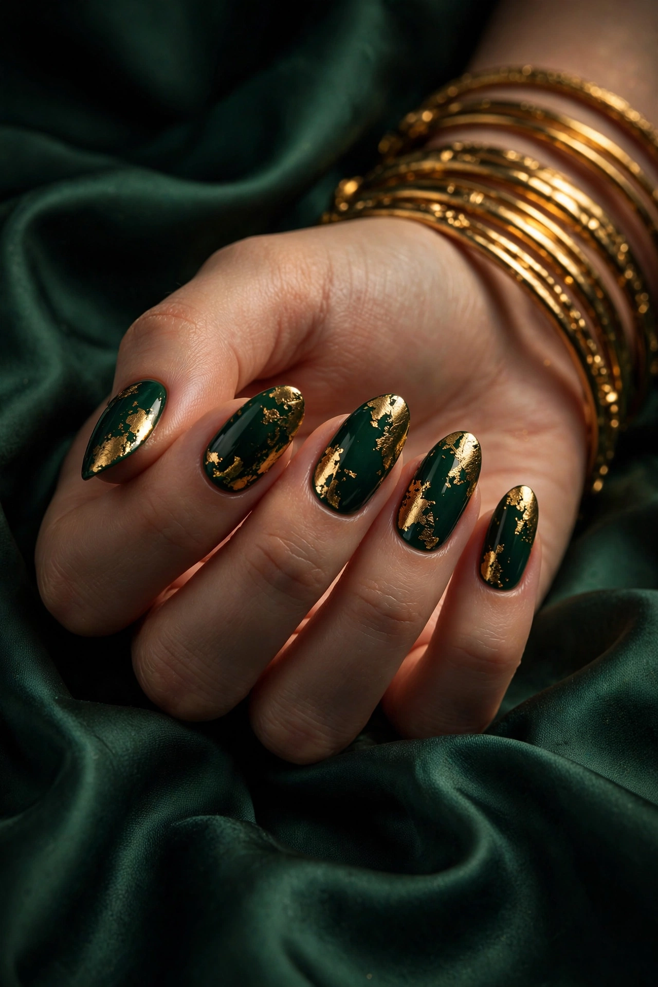 Emerald nails with gold foil and bangles