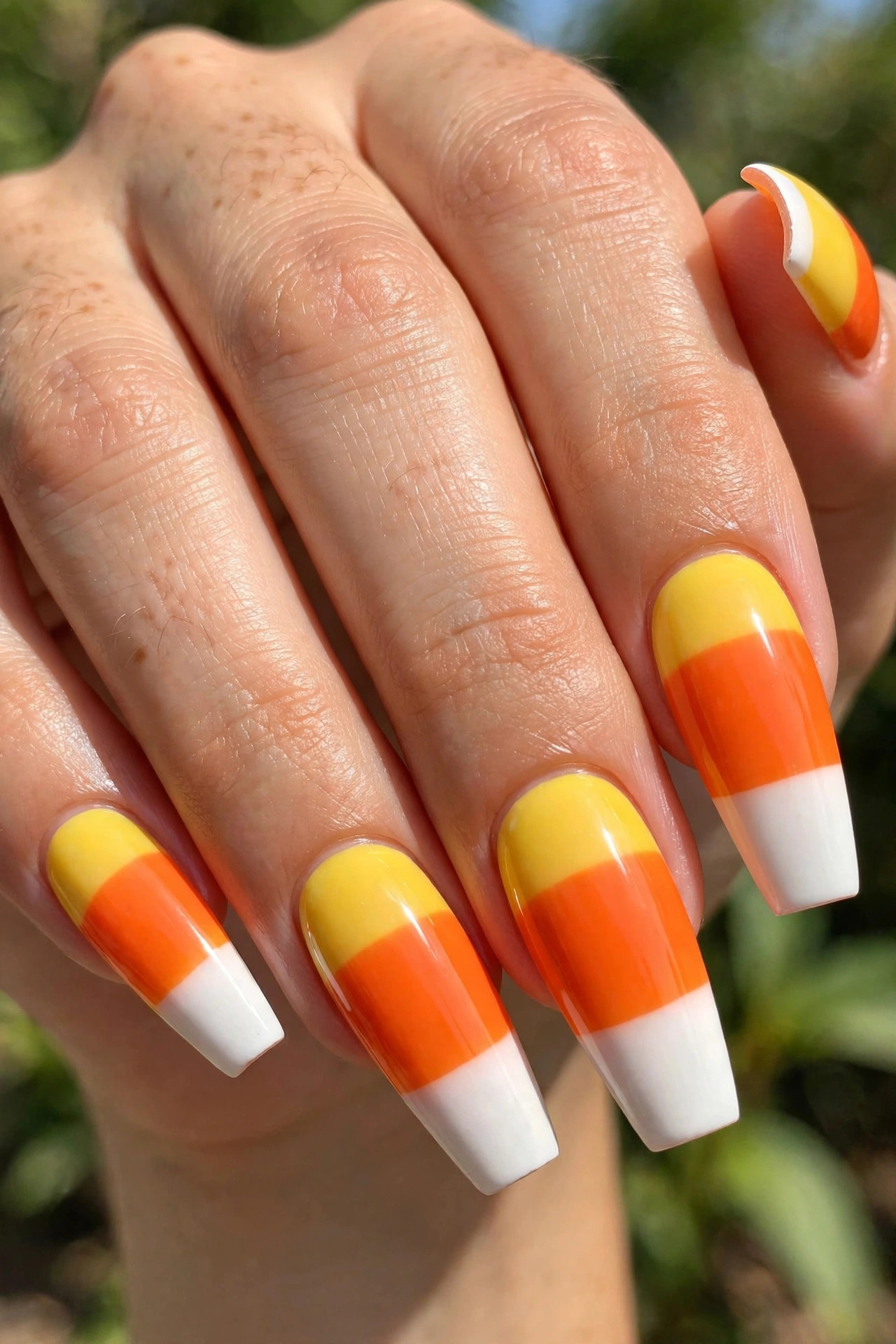Long coffin nails with candy corn tri-color tip nail art
